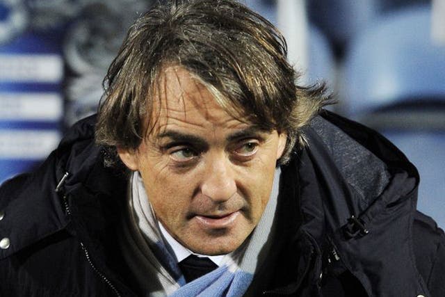 Roberto Mancini believes City will chase down United’s lead