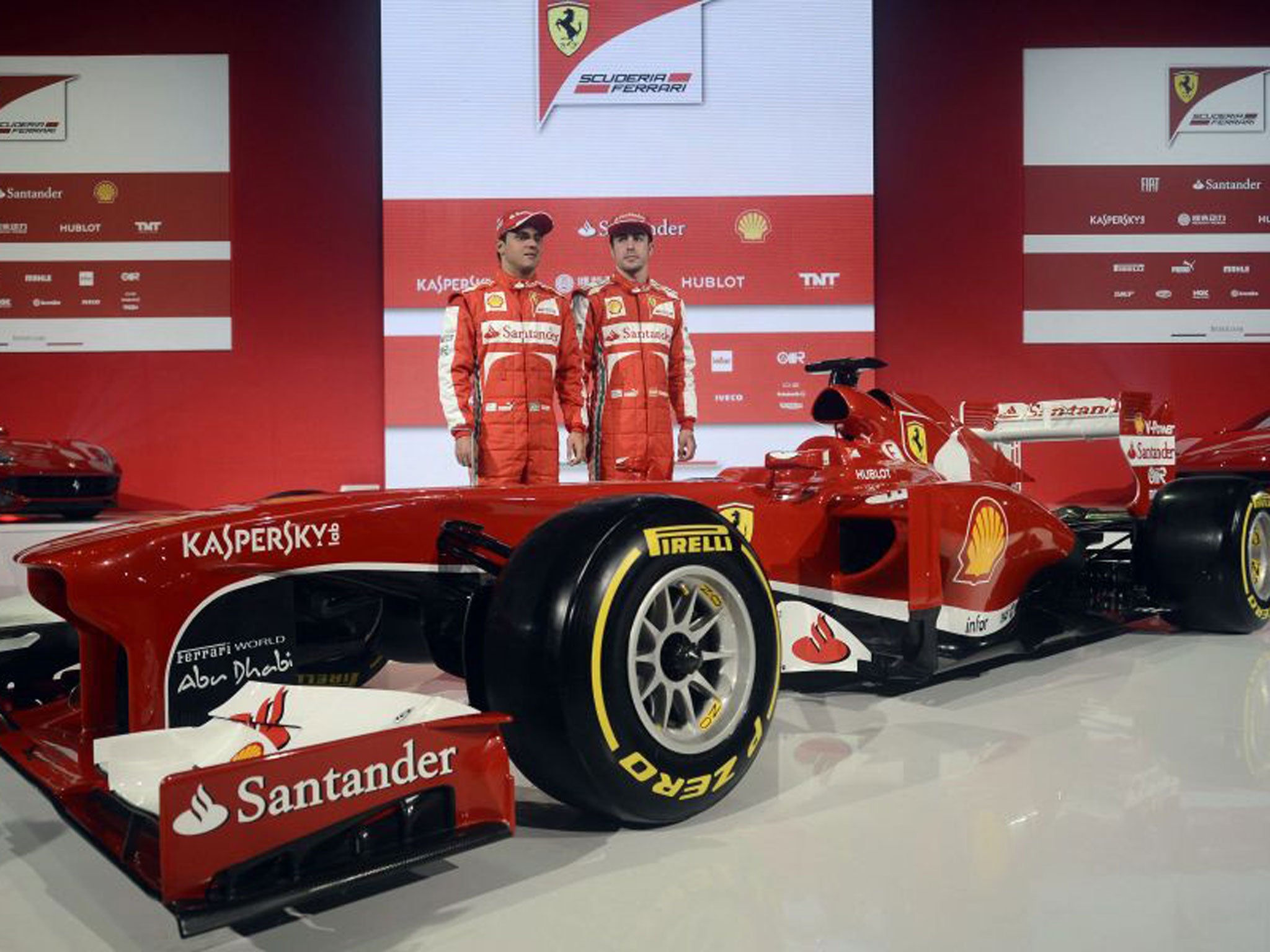 Fernando Alonso (right) and Felipe Massa at the launch of the new Ferrari F138 in Italy