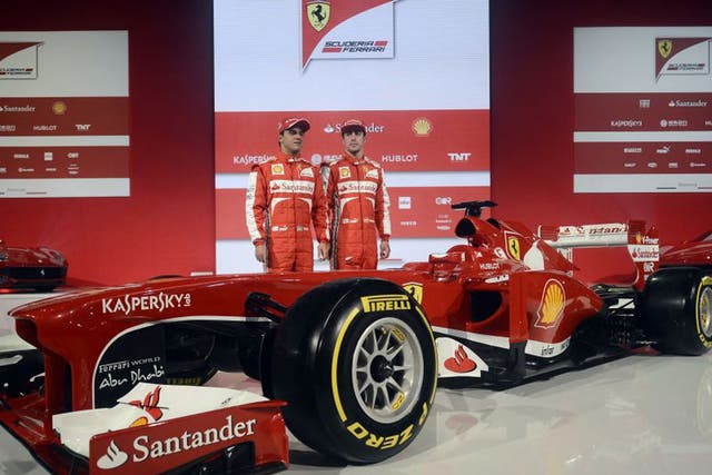 Fernando Alonso (right) and Felipe Massa at the launch of the new Ferrari F138 in Italy yesterday
