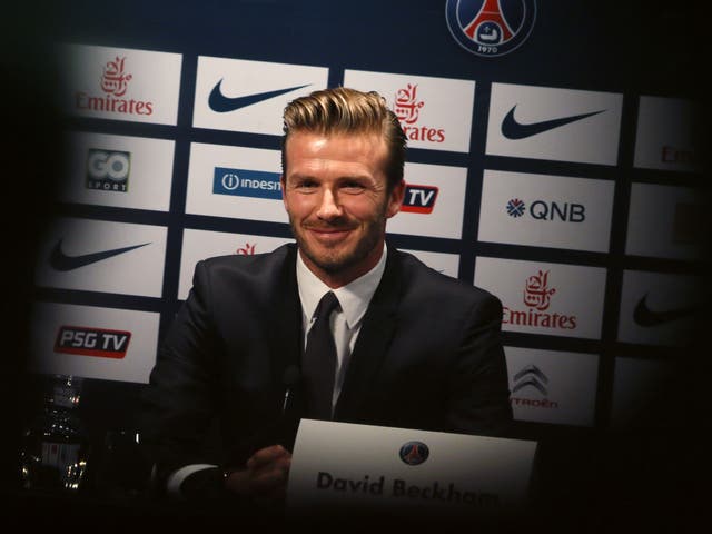 Centre forward: David Beckham enjoys the limelight – and does good out of sight