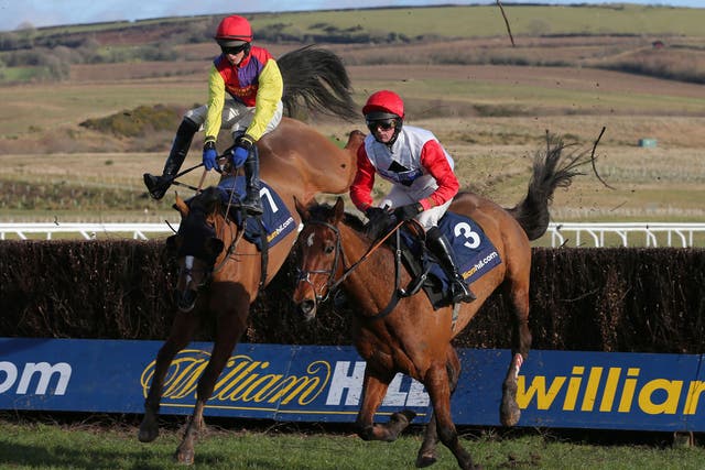 Jump lead: Nico de Boinville (right) on Carruthers moves ahead of Shaking Hands to win the West Wales National