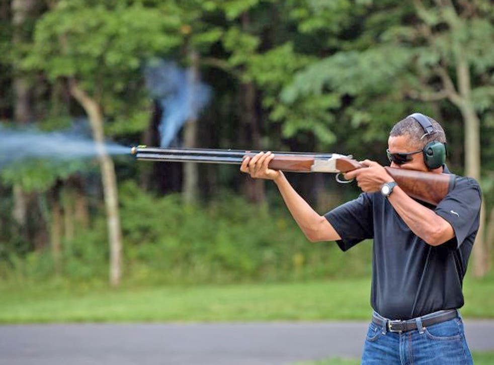 President Barack Obama shoots clay targets with a shotgun on the range at Camp David, Maryland. Obama has put forth great effort to pass legislation to ban assault rifles in the wake of the Newtown