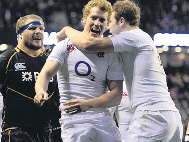 Billy Twelvetrees is congratulated on scoring a try for England