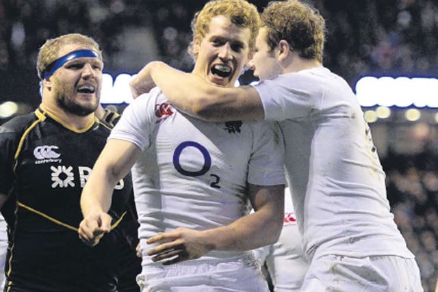 Billy Twelvetrees is congratulated on scoring a try for England