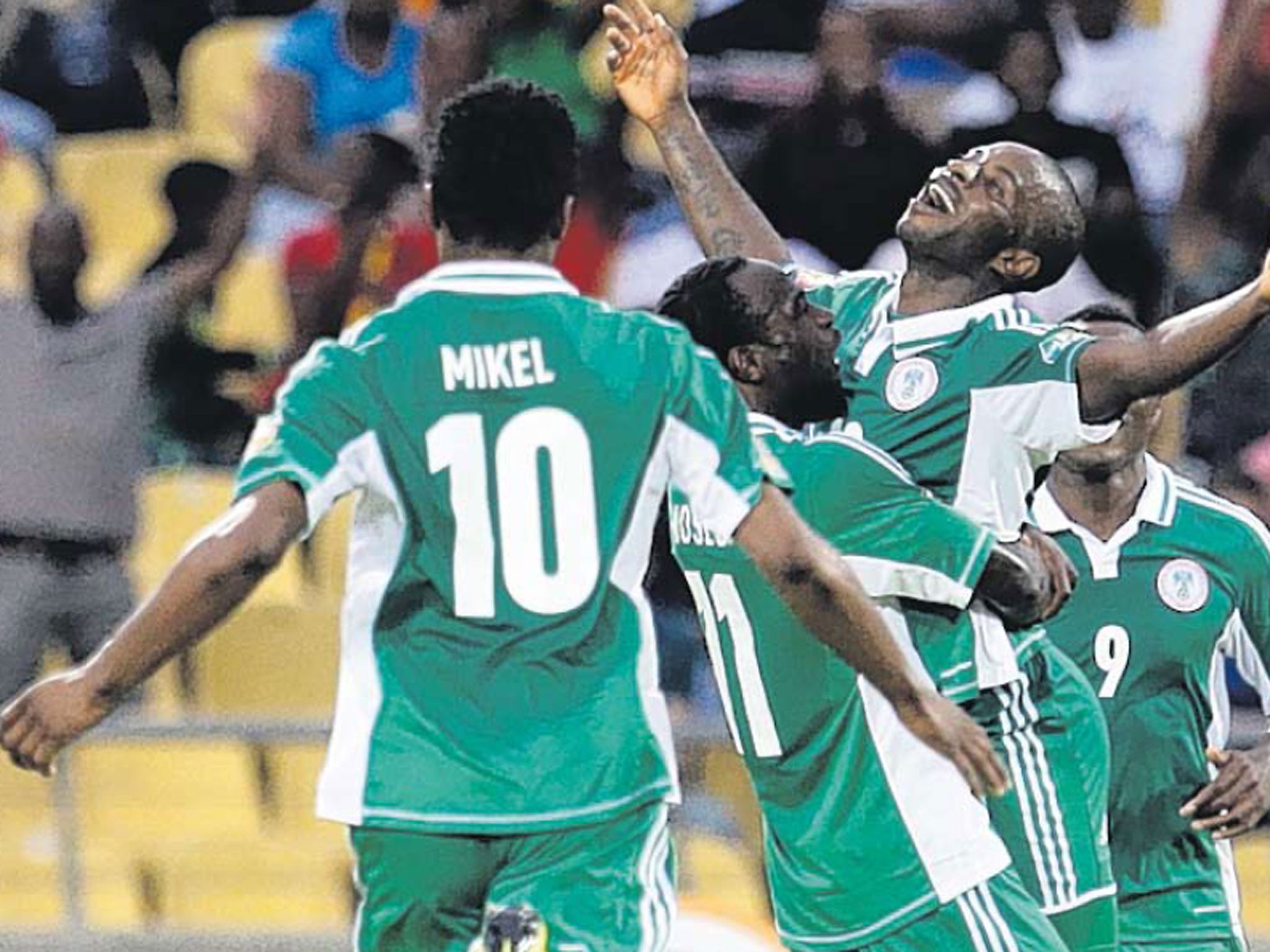 Nigeria’s Sunday Mba is congratulated by his team-mates yesterday