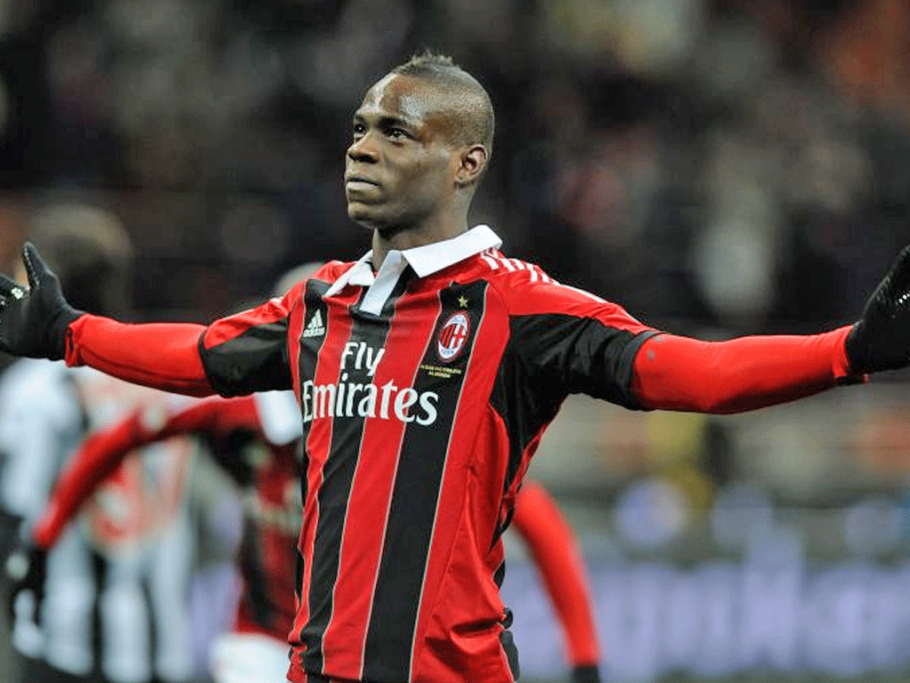Mario Balotelli celebrated his Milan debut by scoring twice in a 2-1 win over Udinese last night
