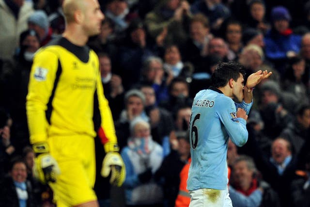 Sergio Aguero celebrates after scoring from a near impossible angle for Manchester City during their 2-2 draw with Liverpool
