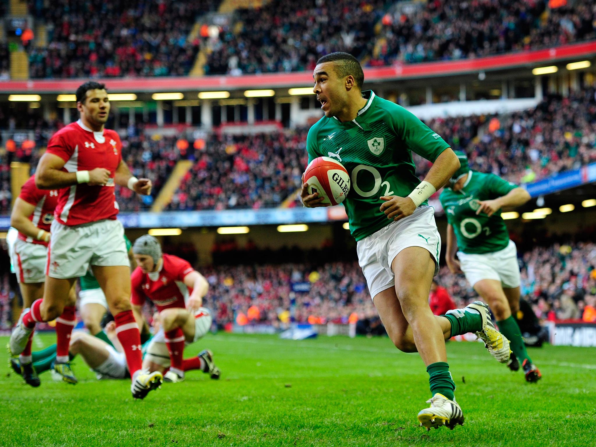 Ireland wing Simon Zebo runs in the first try against Wales