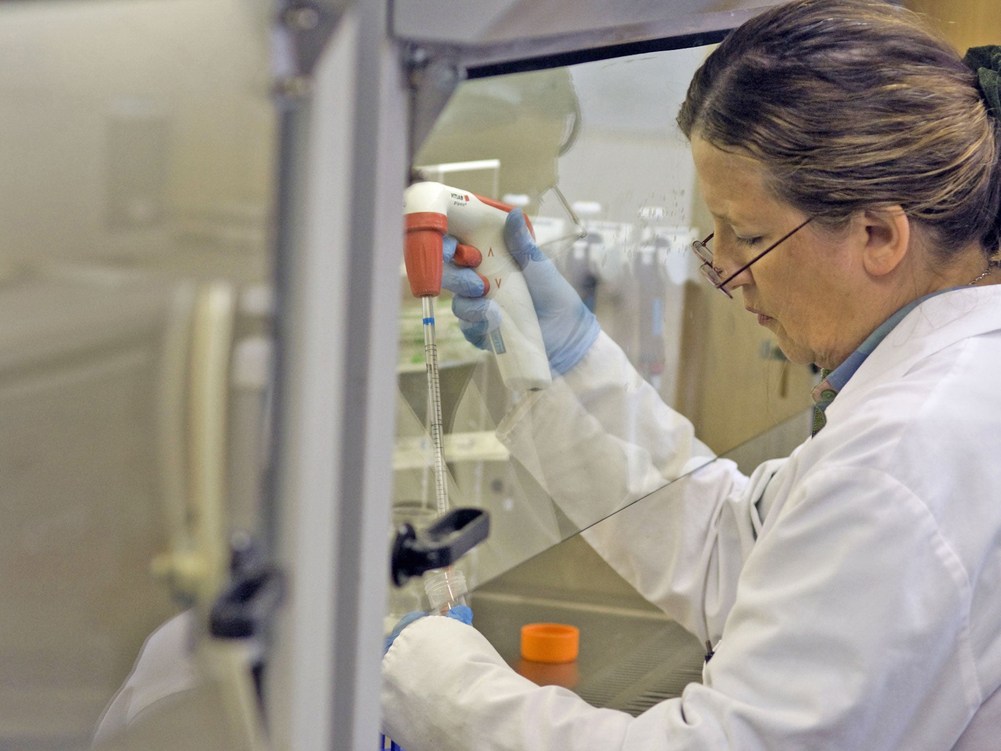 A medical technician works at the South African Tuberculosis Vaccine Initiative (SATVI) at Brewelskloof Hospital