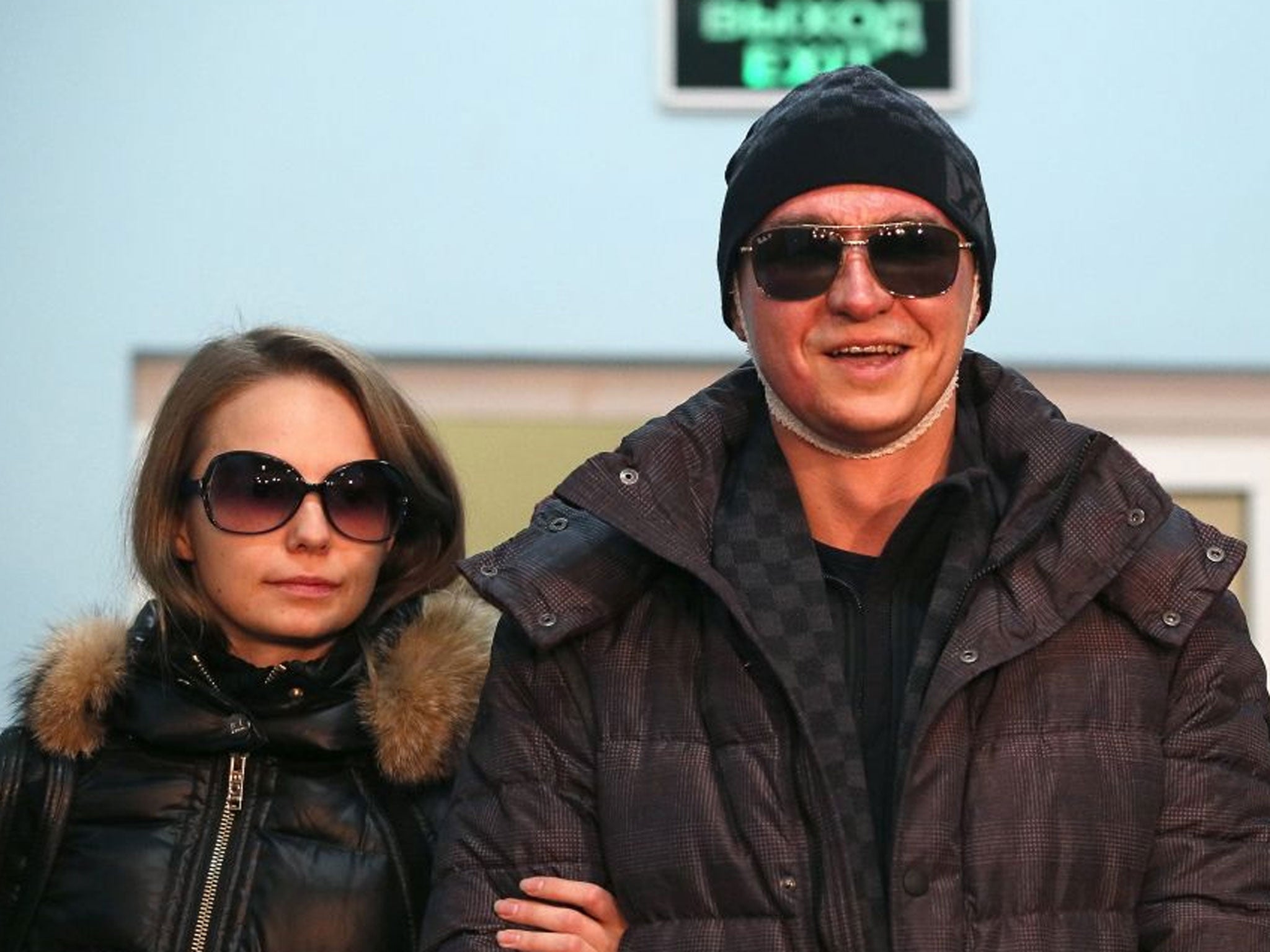 Sergei Filin (right), Artistic Director of the Bolshoi Ballet, and his wife Maria Provich (left) are seen as he leaves a hospital in Moscow, Russia after acid attack