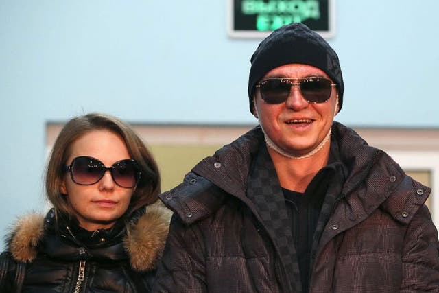 Sergei Filin (right), Artistic Director of the Bolshoi Ballet, and his wife Maria Provich (left) are seen as he leaves a hospital in Moscow, Russia after acid attack