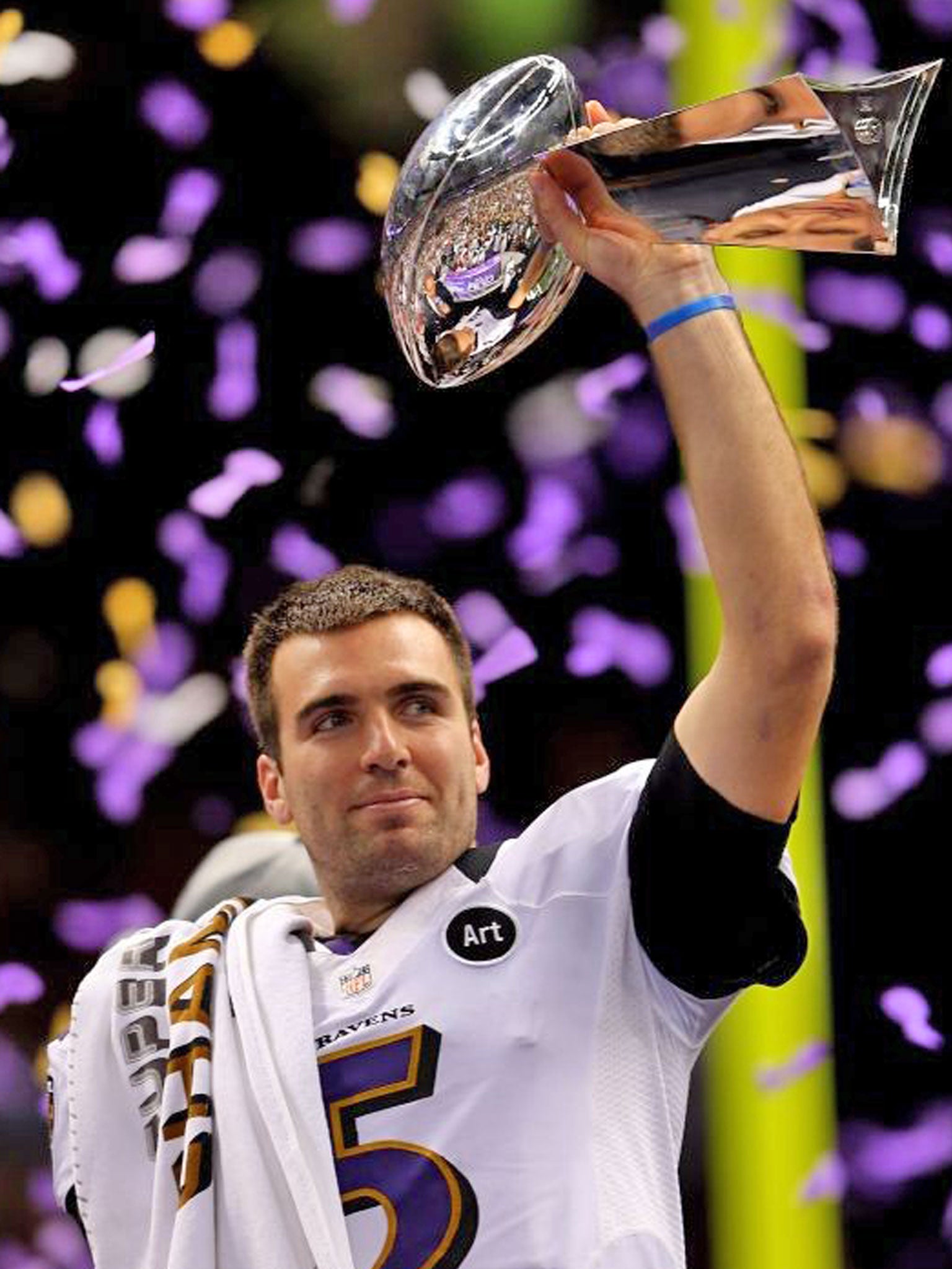 Baltimore quarterback Joe Flacco gets his hands on the Vince
Lombardi Trophy