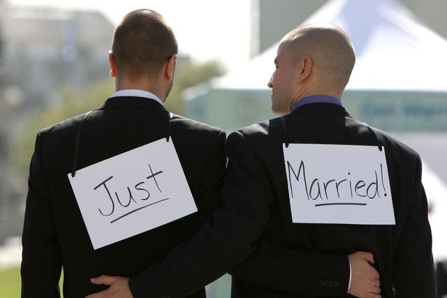 Same-sex couple Ariel Owens (R) and his spouse Joseph Barham walk arm in arm after they were married at San Francisco City Hall June 17, 2008 in San Francisco, California. 