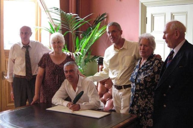 Lance Price and his partner James celebrate their civil partnership in 2008, surrounded by friends and family.
