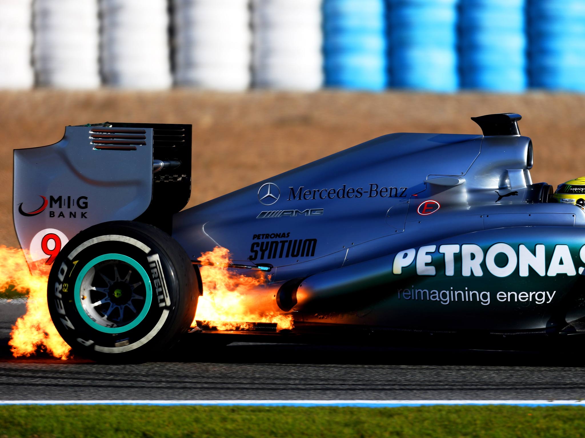 Flames seen at the back of Nico Rosberg's Mercedes