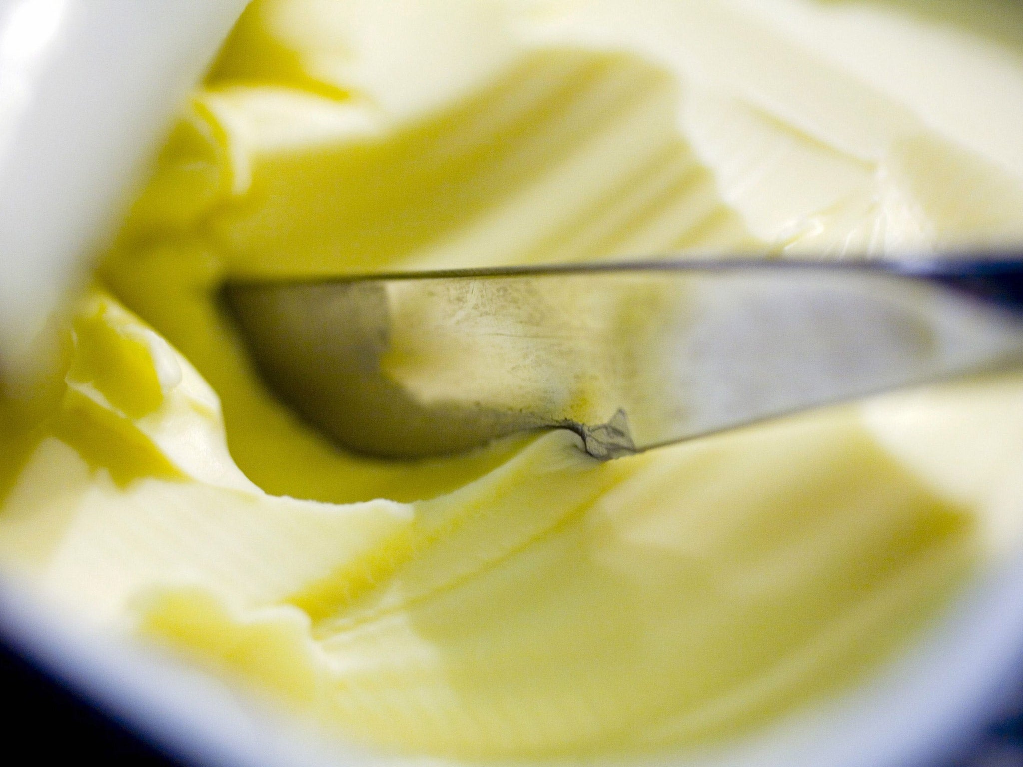 Butter is made by churning fresh cream or milk whereas margarine is made of vegetable fats