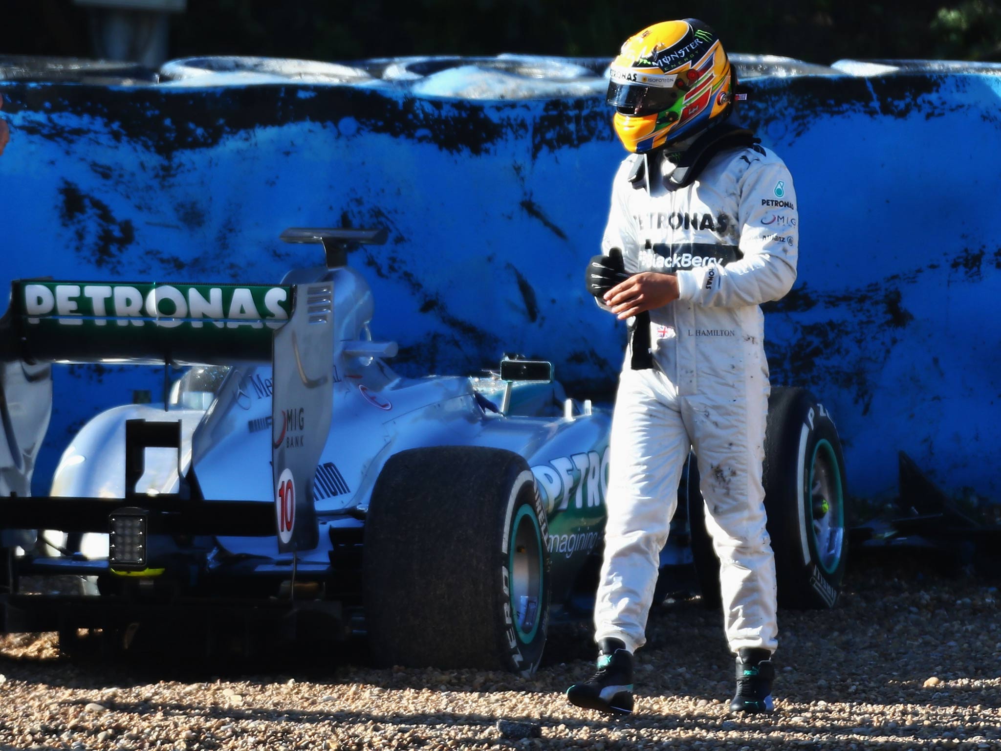Lewis Hamilton walks away after crashing his Mercedes during testing