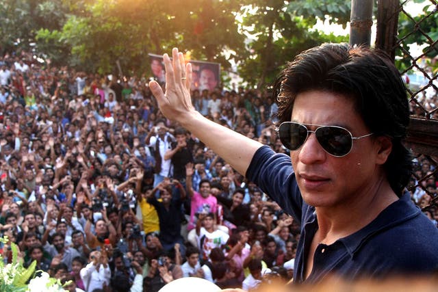 <p>Indian Bollywood actor Shah Rukh Khan waves to fans outside his house  in Mumbai</p>