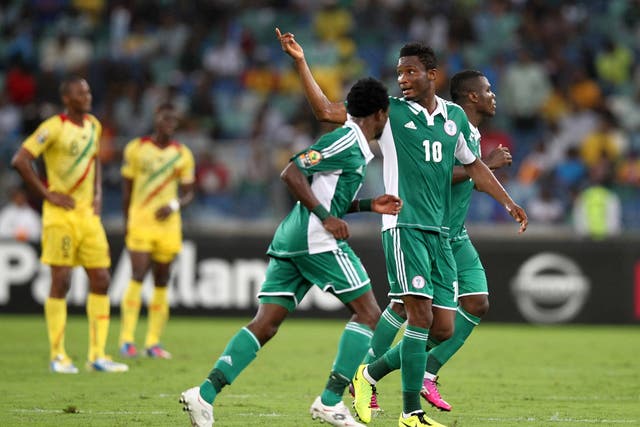  John Obi Mikel of Nigeria celebrates during victory over Mail in the African Cup of Nations