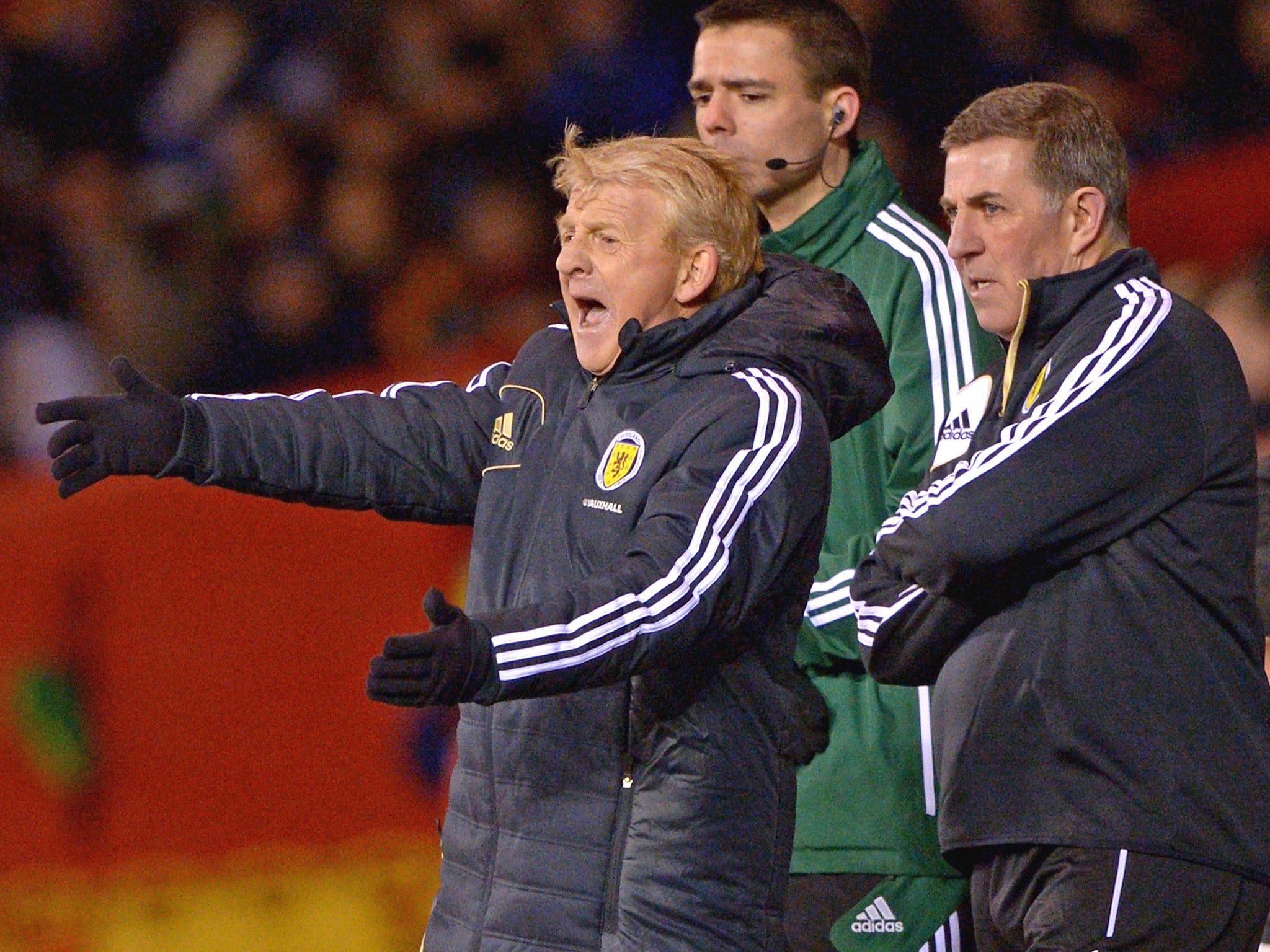 New Scotland manager Gordon Strachan, left, makes a point to his players last night