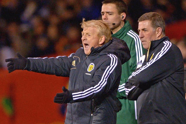 New Scotland manager Gordon Strachan, left, makes a point to his players last night