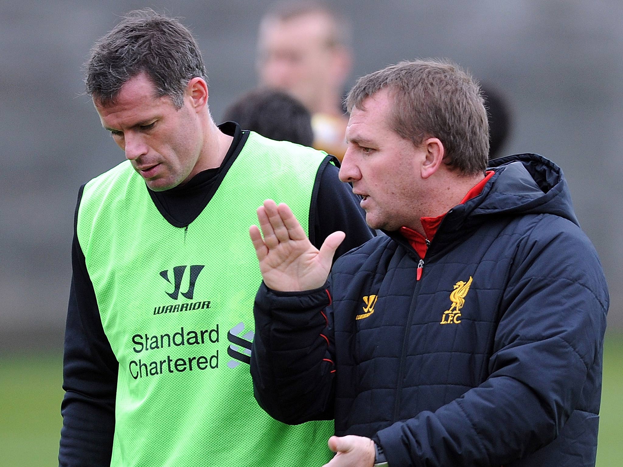 Jamie Carragher with Liverpool manager Brendan Rodgers