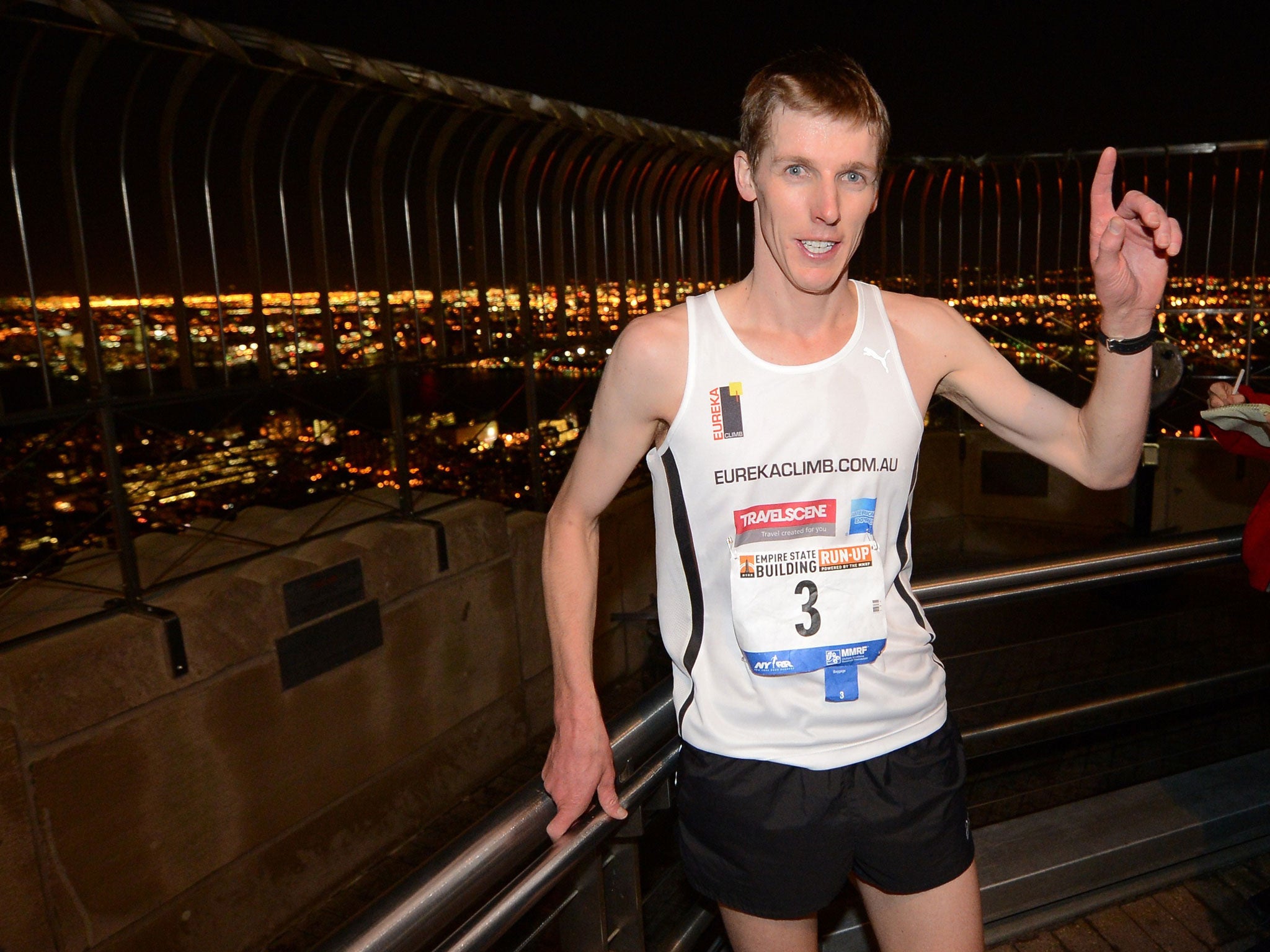 Mark Bourne celebrates after crossing the finish line winning the 36th annual Empire State Building run-up in New York