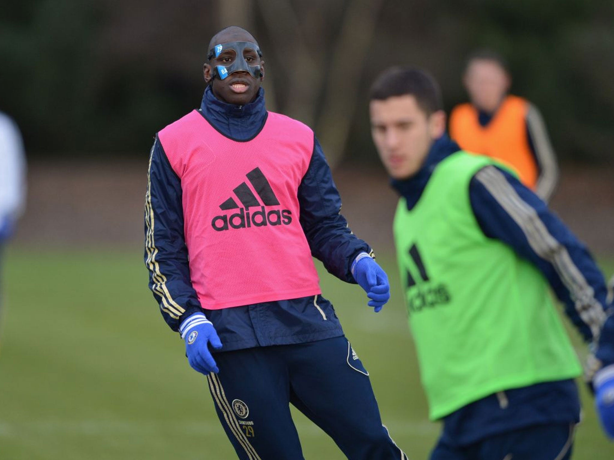 Demba Ba trains in his protective mask ahead of Chelsea's game with Wigan.
