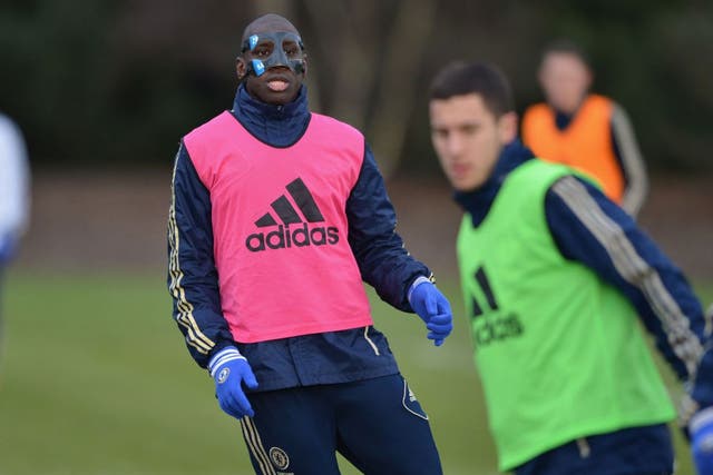 Demba Ba trains in his protective mask ahead of Chelsea's game with Wigan.