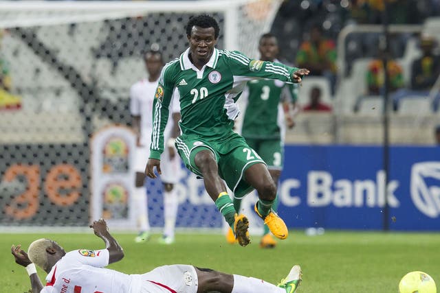 Igiebor Nosakhare Emmanuel and Djakaridja Kone during the 2013 Orange African Cup of Nations match between Nigeria and Burkina Faso
