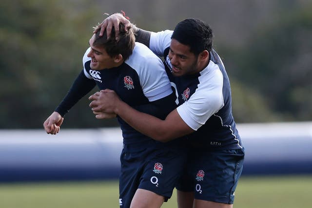 Manu Tuilagi gets to grips with Toby Flood during England training