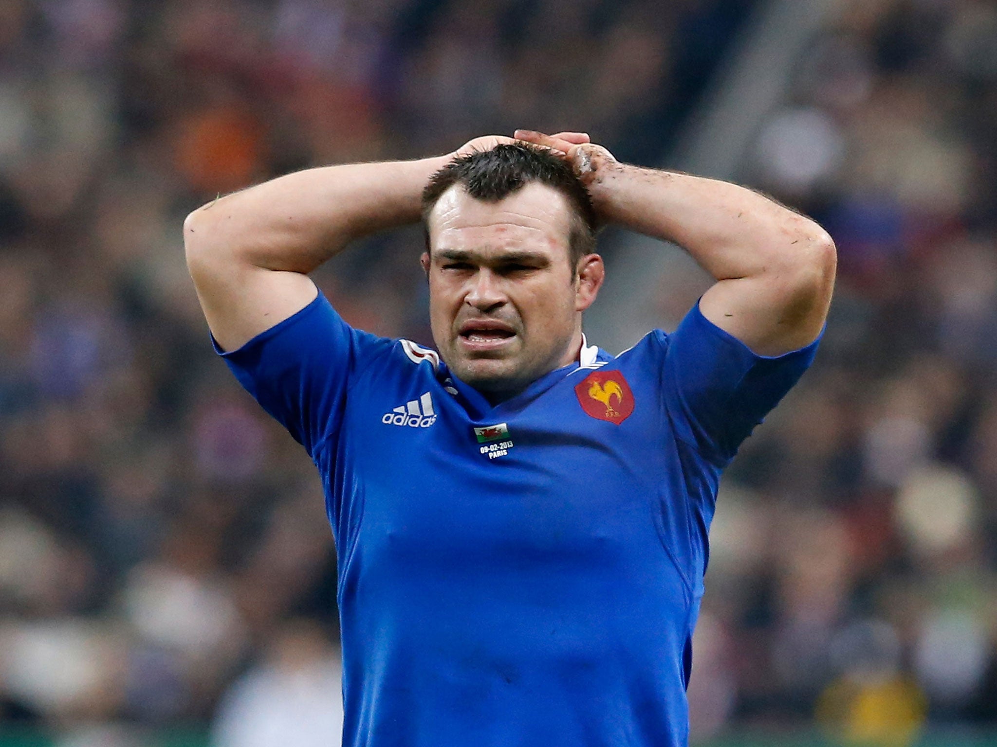 Nicolas Mas of France holds his head in disappointment during his team's match with Wales