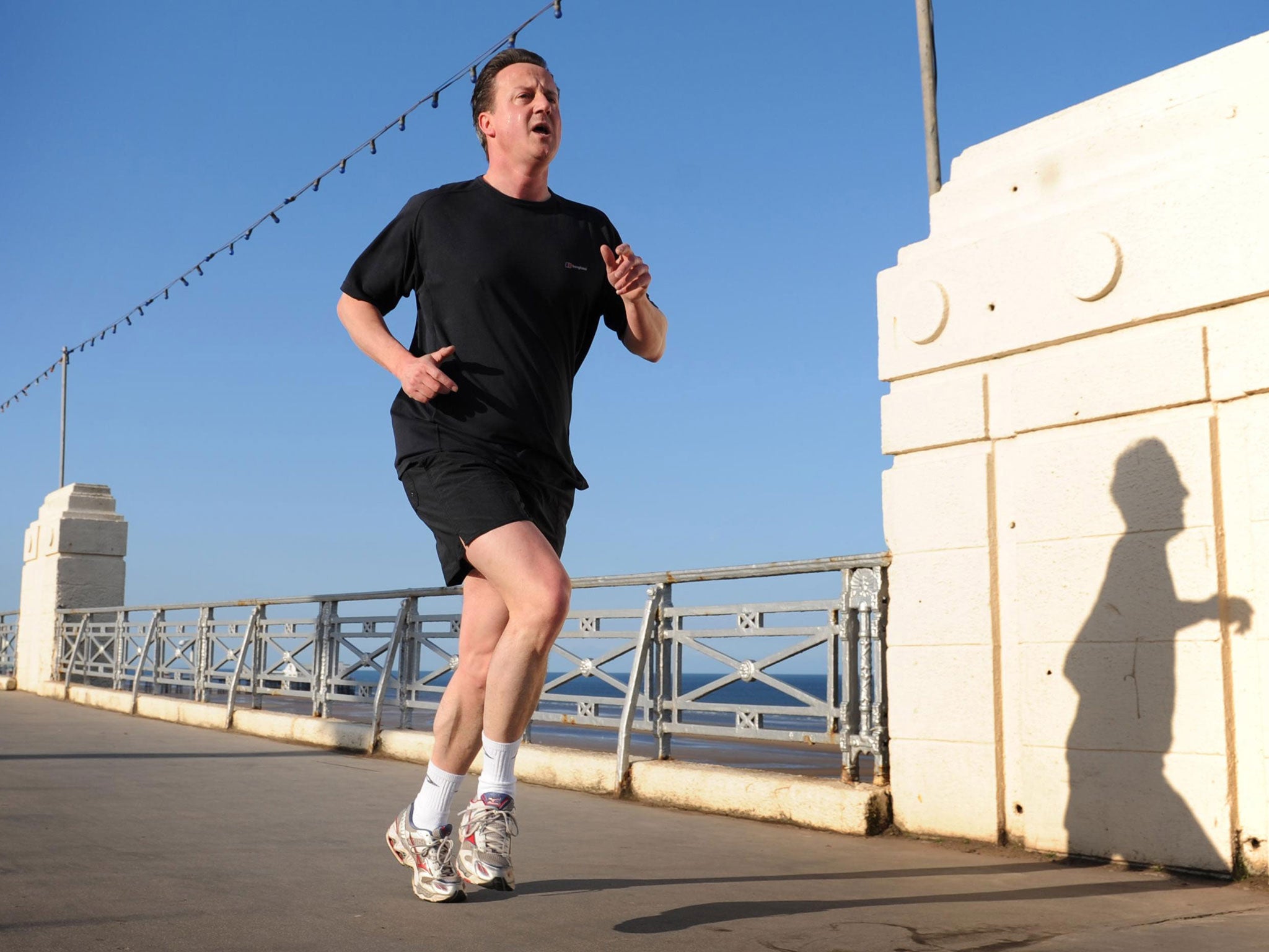 Is Eastleigh ready for the fastest politician in the West?: David Cameron runs along the seafront in Blackpool. He will be hot-footing it to Eastleigh next week, on a Benny Hill-themed pilgrimage, presumably.