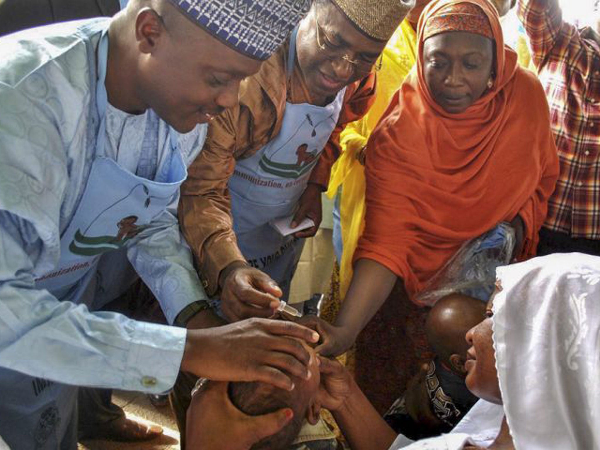 A Nigerian child is given the polio vaccine. According to police reports clinics administering the vaccine have been targetted by gunmen thought to be aligned with the Boko Haram sect