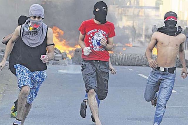 Youths flee after hurling petrol-bombs at police near Manama