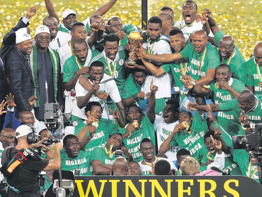 Nigeria’s players celebrate after winning the Cup