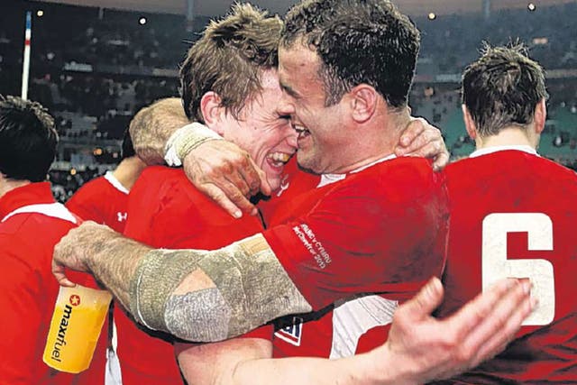 Jonathan Davies (left), of Wales, celebrates with Jamie Roberts