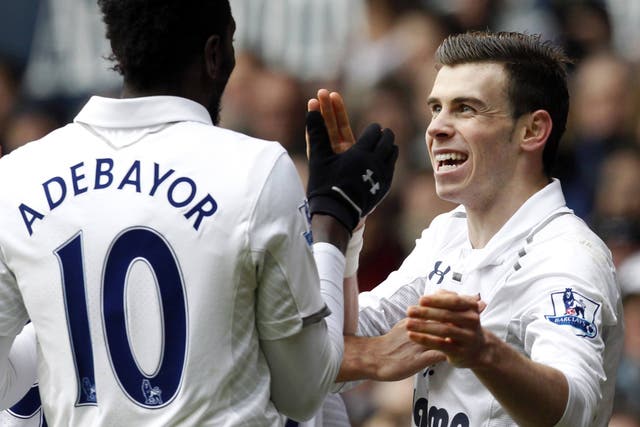 Emmanuel Adebayor celebrates with Gareth Bale 