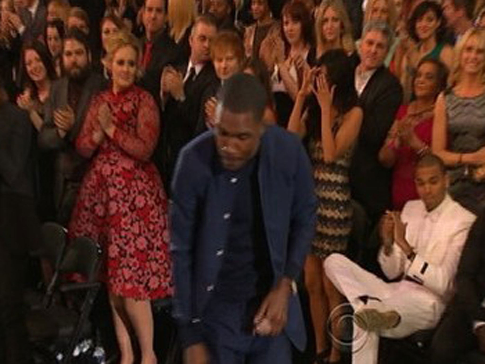 Chris Brown remains seated during a standing ovation for Frank Ocean at the 2013 Grammys