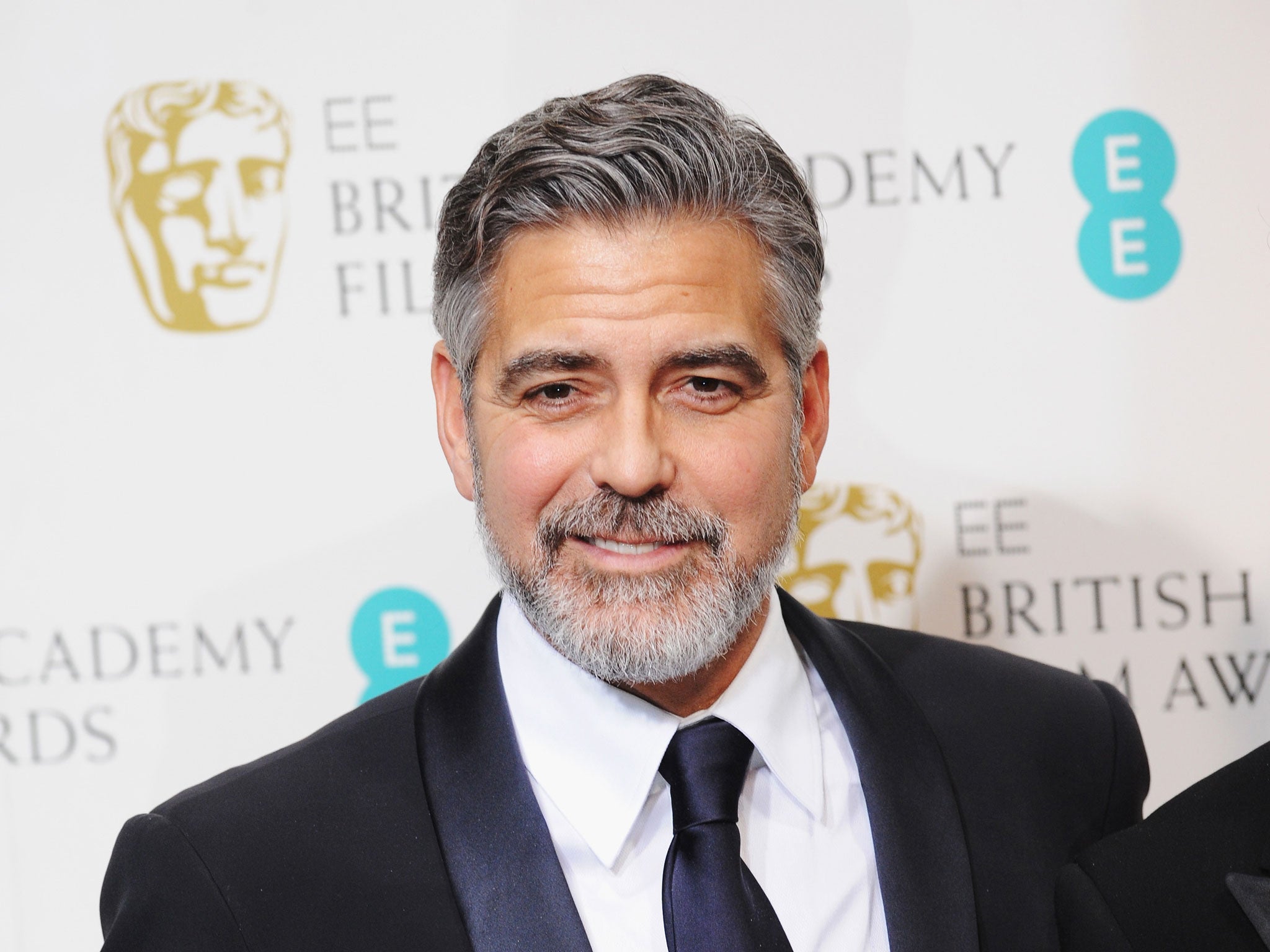 George Clooney, winner of the Best Film award for 'Argo', poses in the press room at the EE British Academy Film Awards at The Royal Opera House on February 10, 2013 in London, England.
