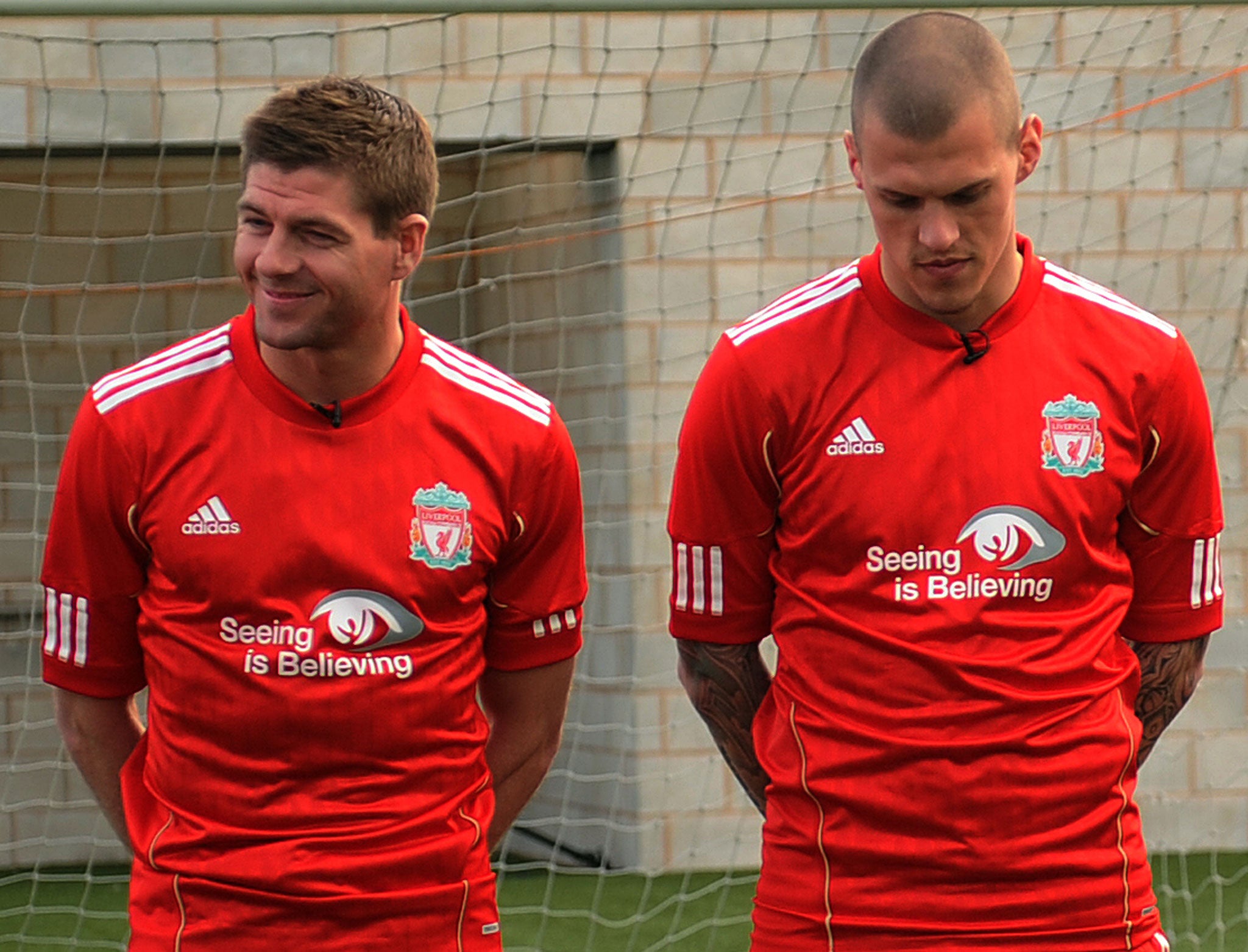 Liverpool's Steven Gerrrard and Martin Skrtel promote the club's Seeing is Believing campaign