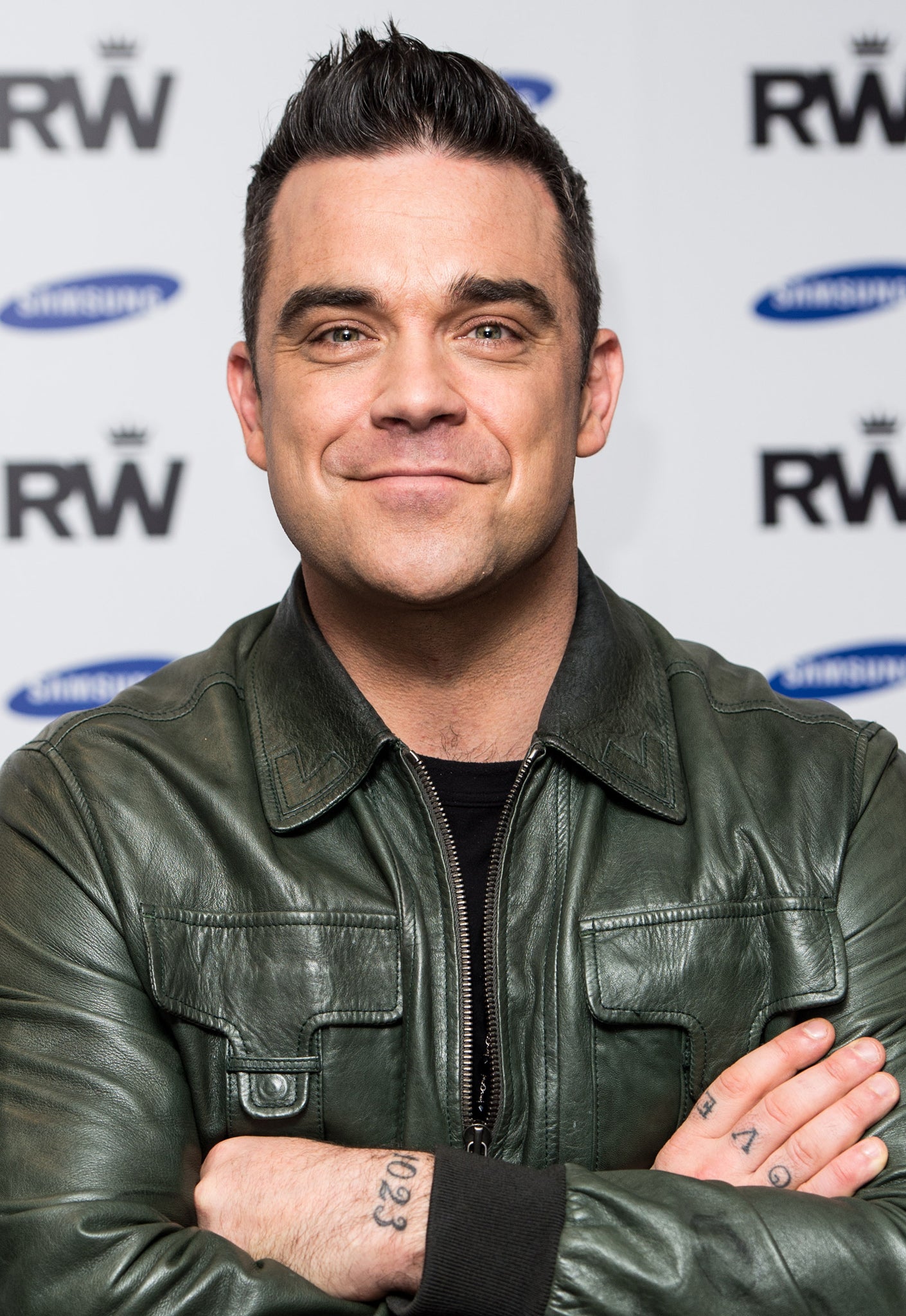 Robbie Williams says his daughter threw up after he sang the song he wrote for her