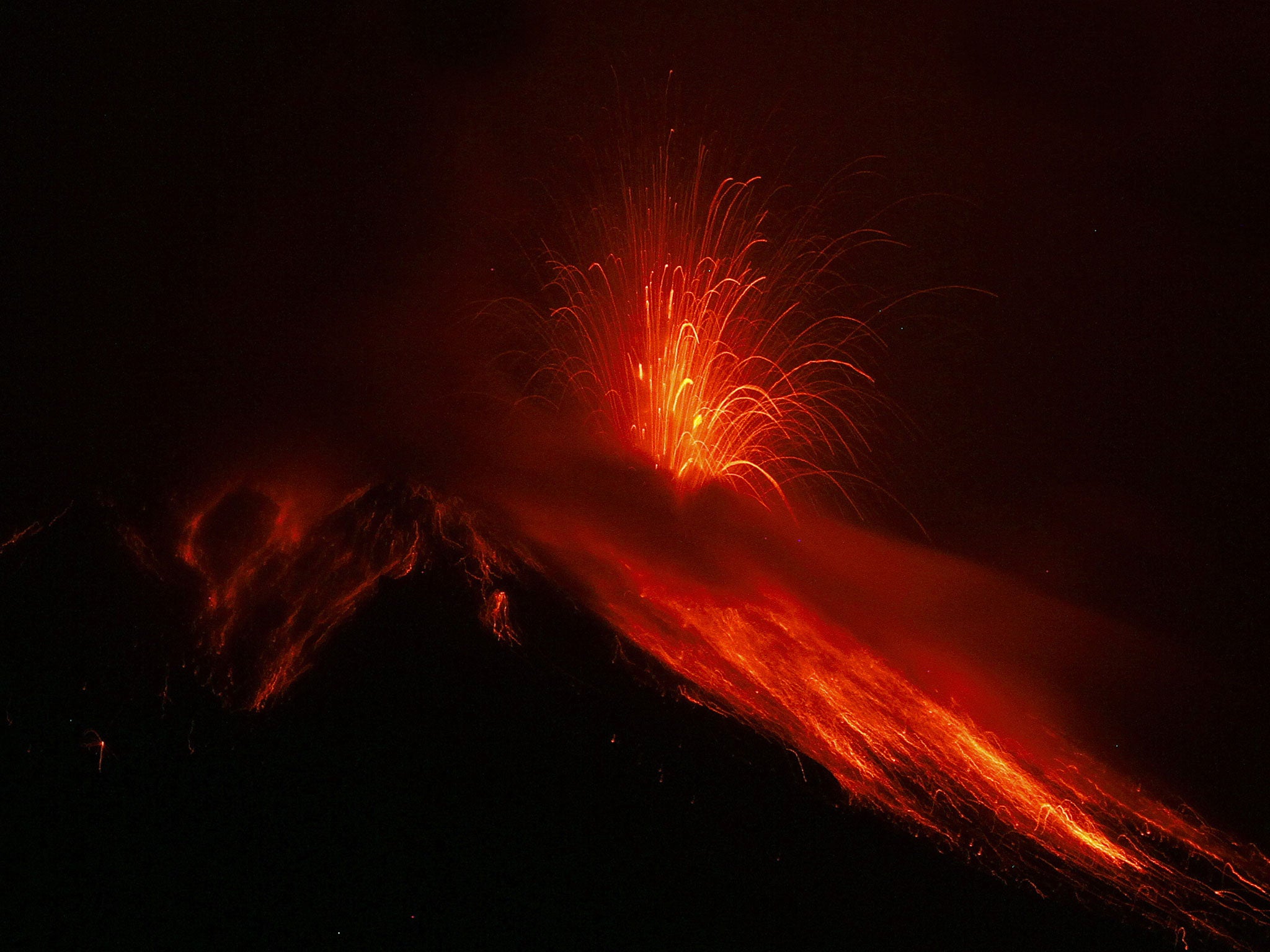 View from Runtun, Ecuador, of the Tungurahua volcano in eruption on December 4, 2010. The Tungurahua, in eruption since 2006, spewed out incandescent materials and ashes during powerful explosions, the national Geophysical Institute said.