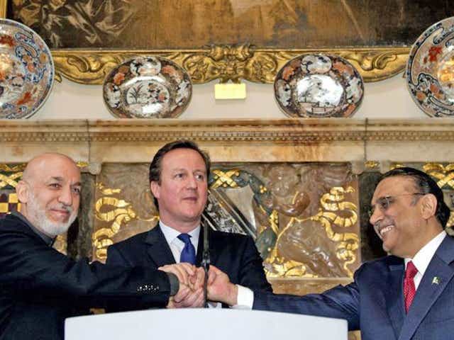 Britain's Prime Minister David Cameron with Afghan President Hamid Karzai (left) and Pakistani President Asif Ali Zardari (right) at Chequers in Buckinghamshire, on 4 February 2013