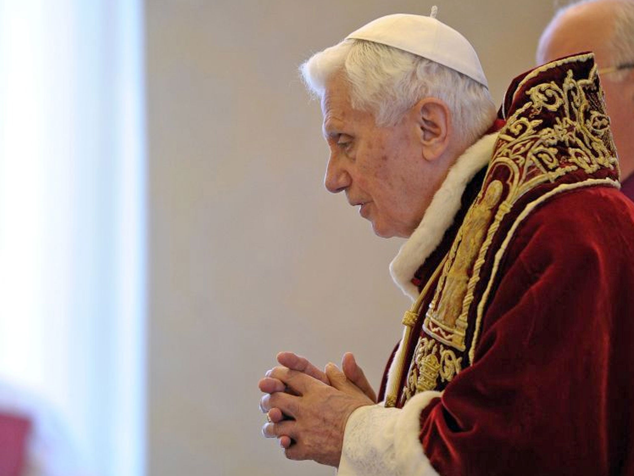 Pope Benedict XVI delivers his message during a meeting of Vatican cardinals, at the Vatican