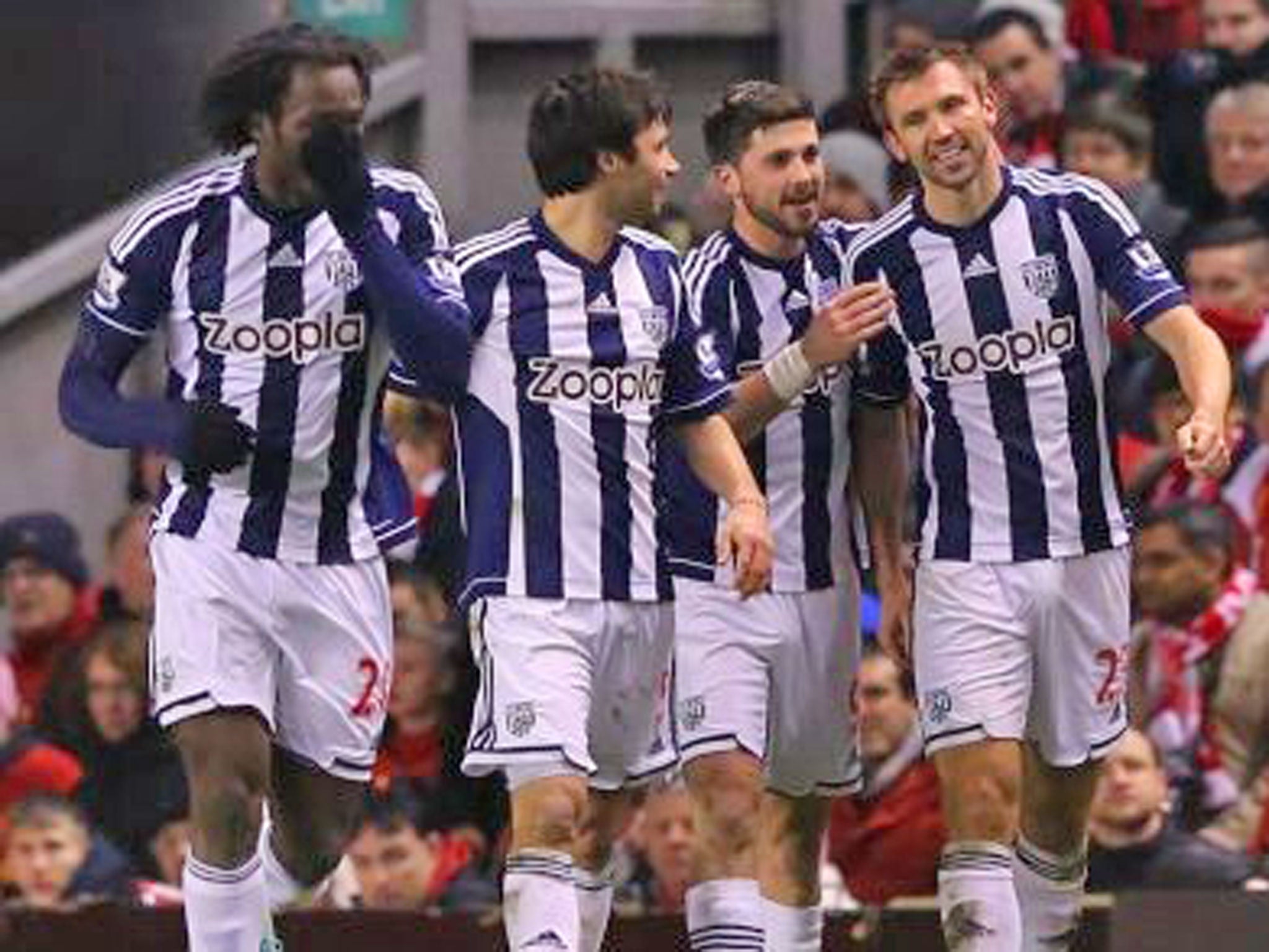 Gareth McAuley is congratulated