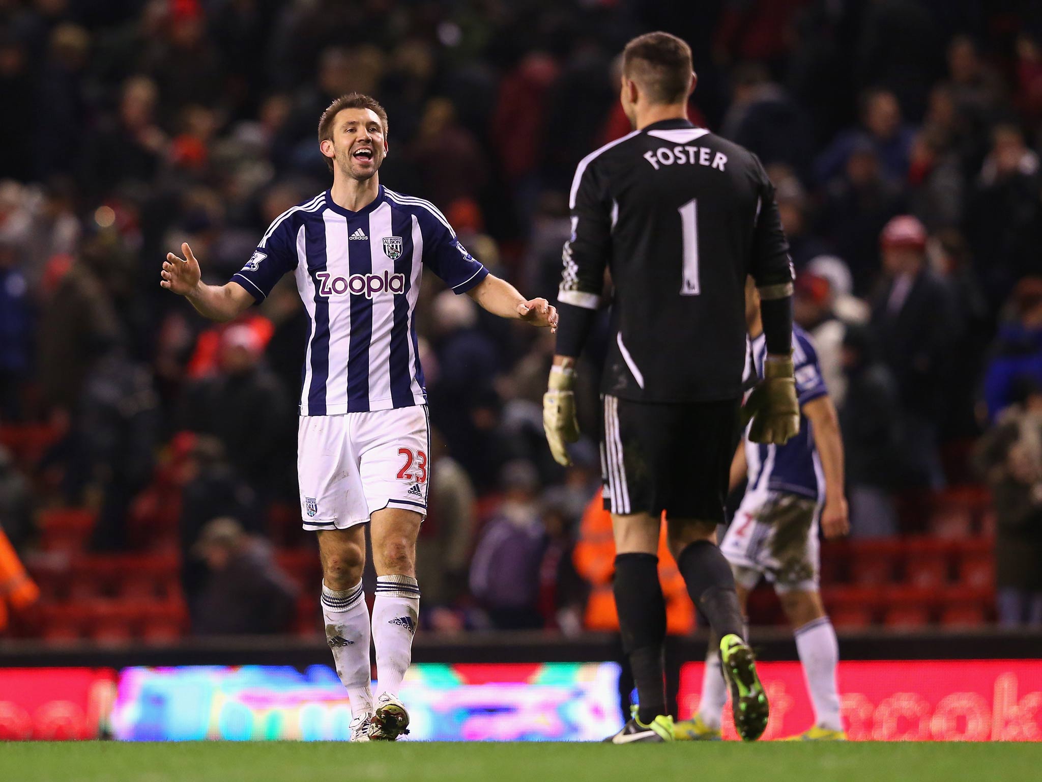 Gareth McAuley and Ben Foster of West Brom celebrate victory over Liverpool at Anfield