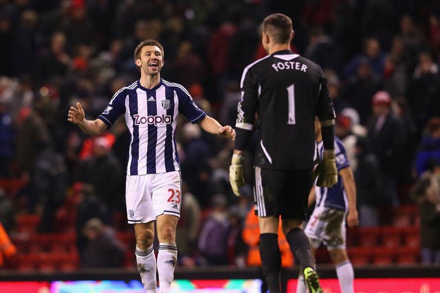 Gareth McAuley and Ben Foster of West Brom celebrate victory over Liverpool at Anfield