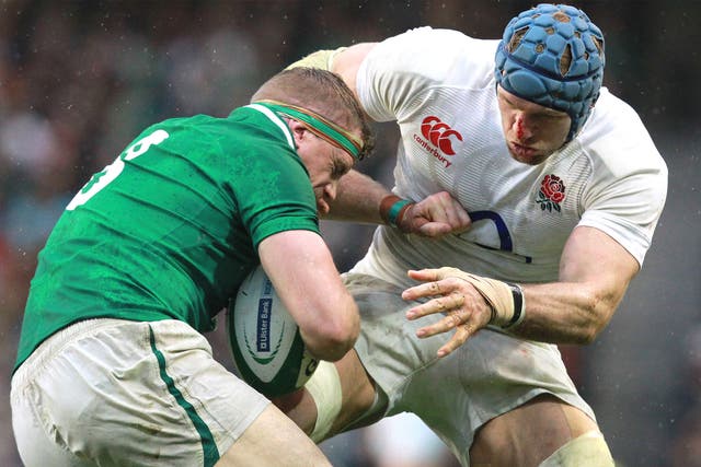 England’s James Haskell tackles Ireland’s Jamie Heaslip last Sunday