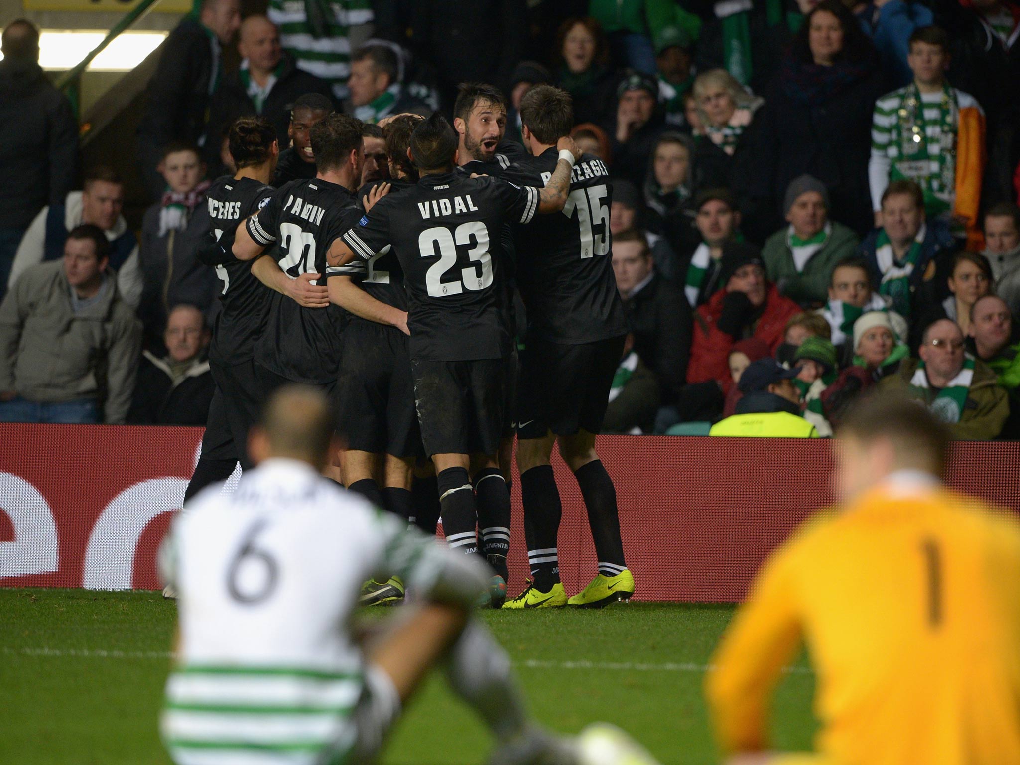 Mirko Vucinic of Juventus celebrates with his team-mates after scoring his team's third goal against Celtic